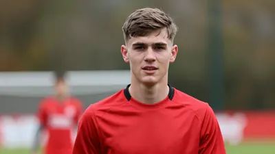 Brentford defender Conor McManus heads to Gillingham in permanent move